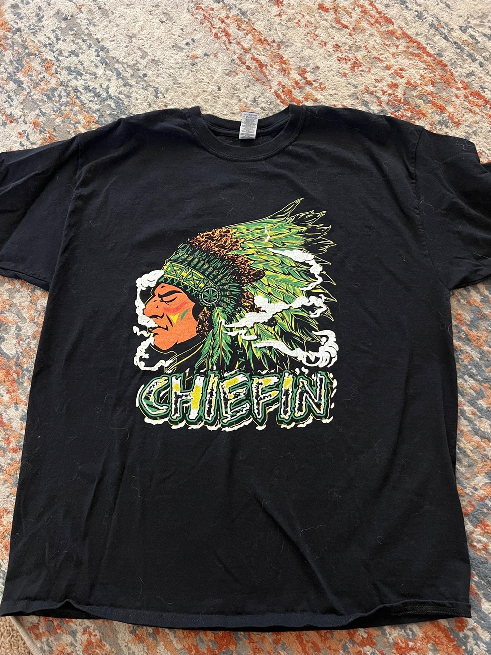 Vintage Men's Black Graphic Tee with Green Feather Chief Design